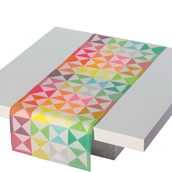 origami table runner in multi colours laid on a table