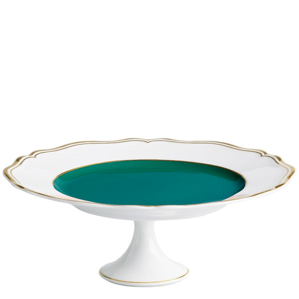 A porcelain cake stand with a scalloped edge and gold detailing, featuring a turquoise interior.