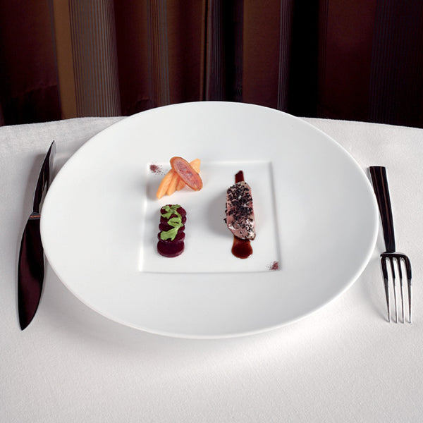srtyled Hommage presentation square center plate by Raynaud, wide-rimmed fine porcelain handcrafted in France for elegant dining presentations.