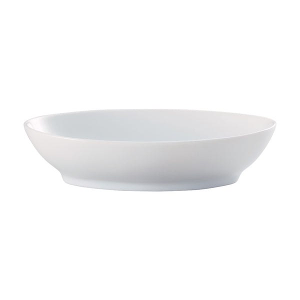 A white, round porcelain dish with a gentle curve at the edges, against a plain background.