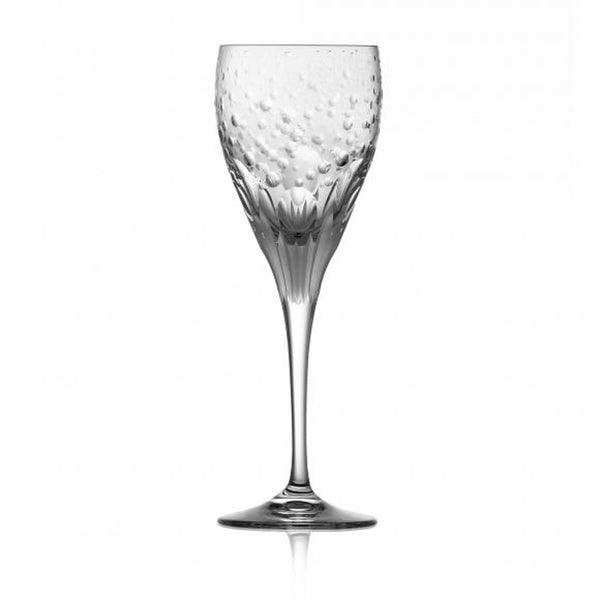 A clear red wine glass with a detailed, artistic design, showcasing the expert craftsmanship of Varga Crystal.