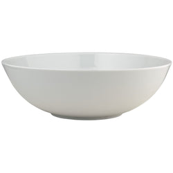 A white porcelain salad bowl with a smooth, rounded design from the 'Uni' Collection by Raynaud.