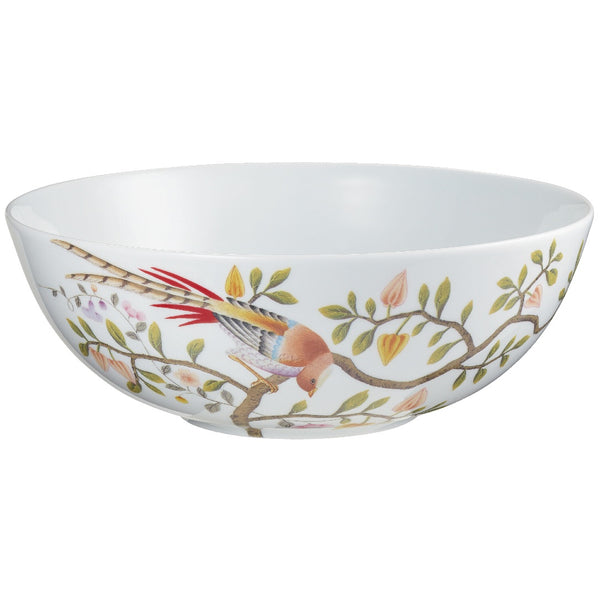 A white porcelain salad bowl with a floral pattern featuring birds and leaves.