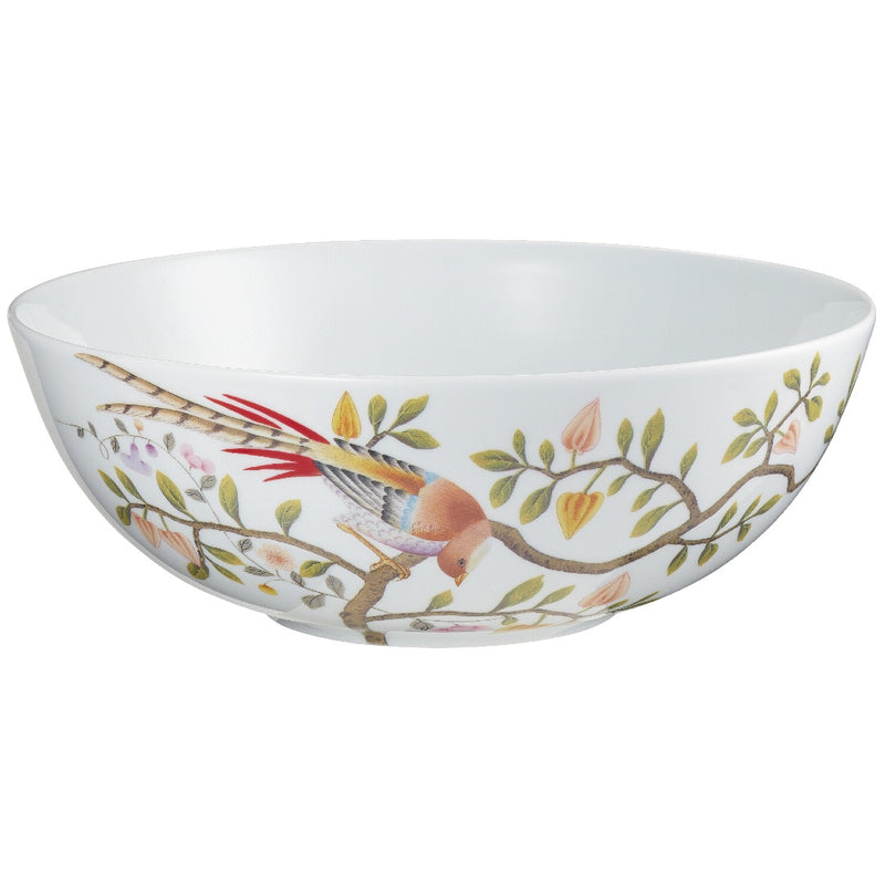 A white porcelain salad bowl with a floral pattern featuring birds and leaves.