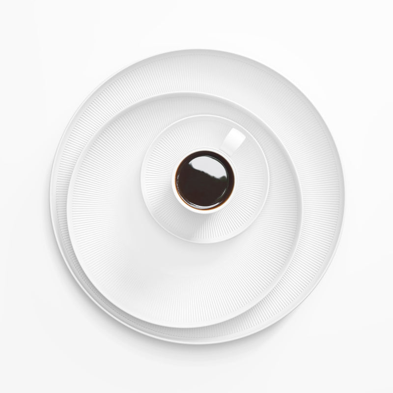 styled Stella Satin White small velvety matte porcelain saucer for espresso cup by SIEGER by FÜRSTENBERG, handcrafted in Germany for refined coffee service.
