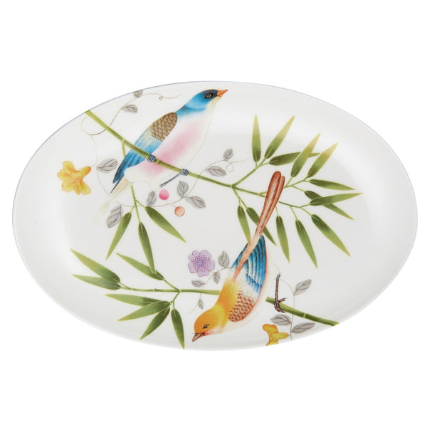 oval porcelain plate in white with birds and leaves pattern