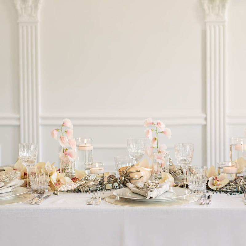Styled table with Handcrafted artificial Lathyrus stem in light pink made from waxed silk by Silk-ka, from the Flowers For Life collection by Amiramour.