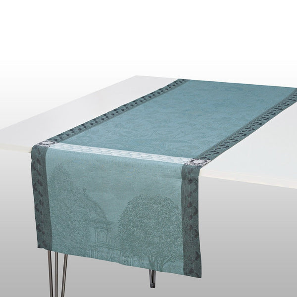 runner in blue and grey on a white tablecloth