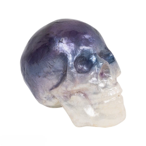 A decorative capiz skull with blue ombre coloring.