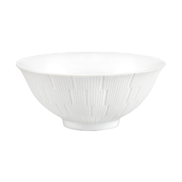 A white porcelain soup bowl with a textured engraved pattern.