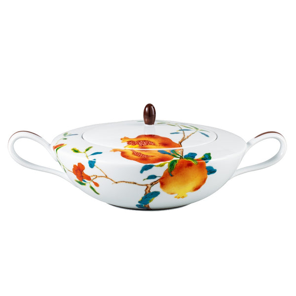 A colorful Raynaud's 'Harmonia' porcelain soup tureen featuring floral patterns with a pomegranate design.