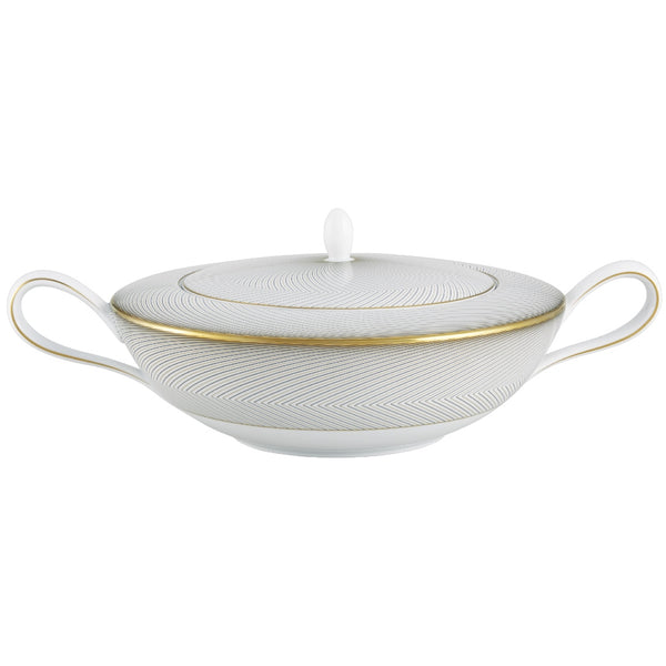 A white, gold, and brown Raynaud porcelain soup tureen with geometric patterns.