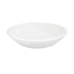 A white porcelain soy bowl with a textured pattern on the interior.