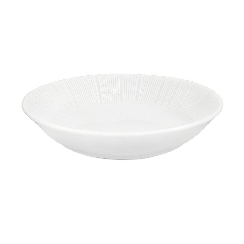 A white porcelain soy bowl with a textured pattern on the interior.