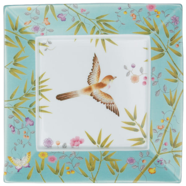 A square porcelain trinket tray with turquoise and white color scheme, featuring a bird, plants, and butterflies embossed on the surface.