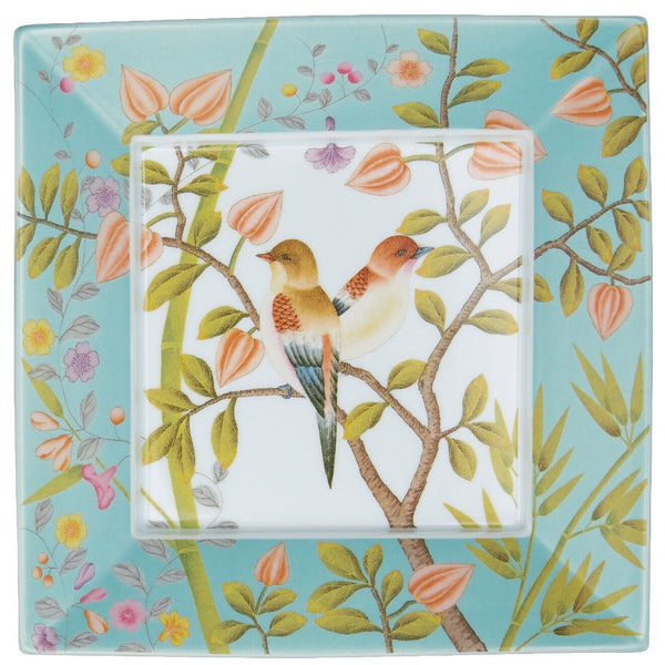 A square porcelain trinket tray with turquoise and white colors featuring birds and floral motifs on a pure white background.