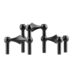 A set of three matte black candle holders with a unique geometric design made by STOFFMADE.