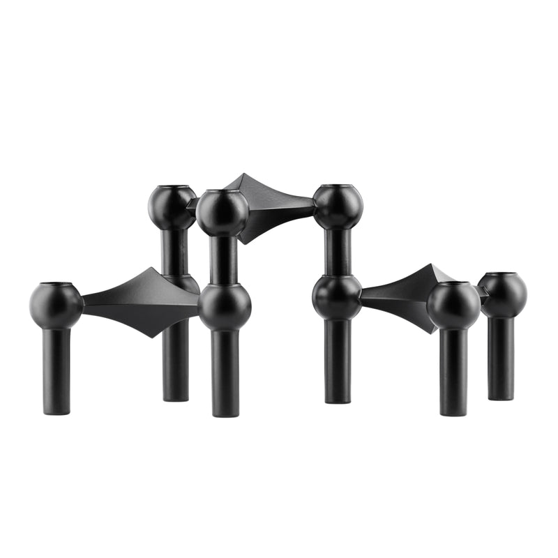 A set of three matte black candle holders with a unique geometric design made by STOFFMADE.