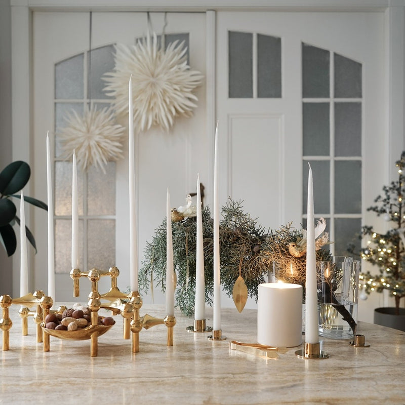 styled festive table with the stoff candle holders in brass