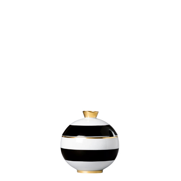 A cylindrical porcelain sugar bowl porcelain sugar bowl from my china ca d oro collection with black and white horizontal stripes spherical form and gold accents by sieger furstenberg