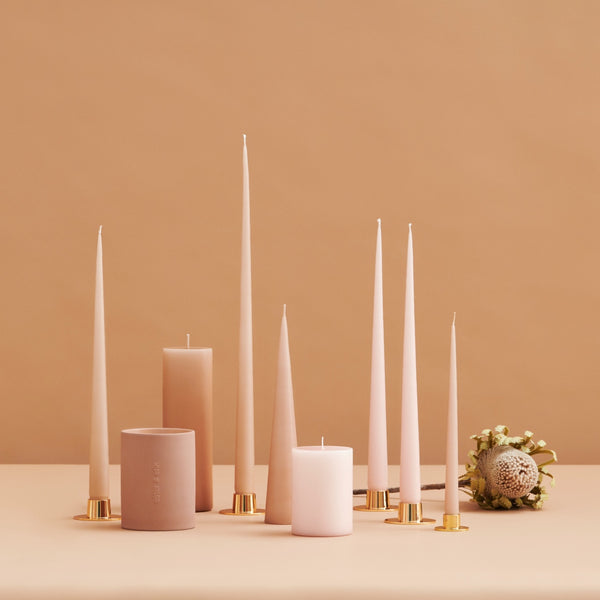 collection of pink neutral pillar and taper candles by Ester and Erik