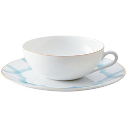 Tea Cup and Saucer Aura by Raynaud in fine Limoges porcelain with golden rim and blue scalloped accents.