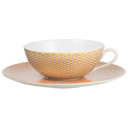 Raynaud Trésor beige porcelain tea cup and saucer with gold-accented honeycomb design