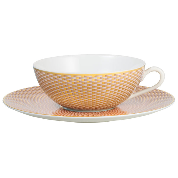 Raynaud Trésor beige porcelain tea cup and saucer with gold-accented honeycomb design