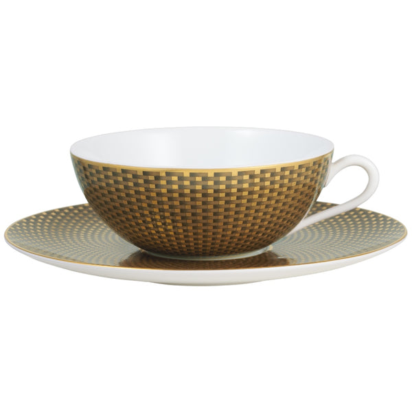 Raynaud Trésor brown porcelain tea cup and saucer with gold-accented honeycomb design