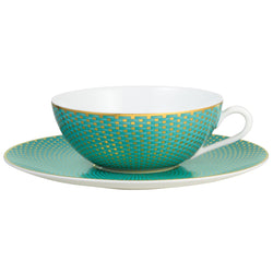 Raynaud Trésor turquoise porcelain tea cup and saucer with gold-accented honeycomb design