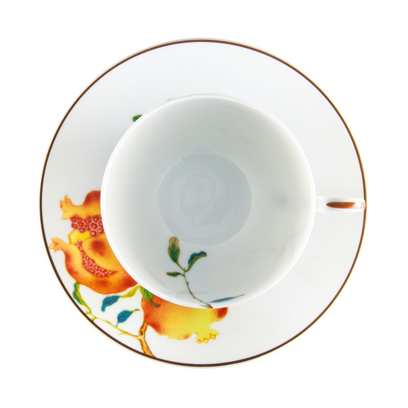 Inside view of the Harmonia luxury porcelain tea cup extra with saucer in white background, decorated with fruit and floral motifs inspired by Chinese imperial art by Raynaud
