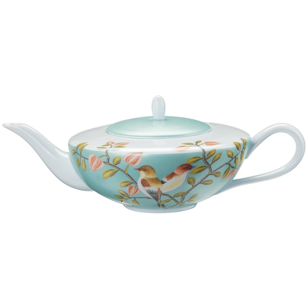 A turquoise and white Limoges porcelain tea pot with birds and floral patterns, featuring a lid and handle.