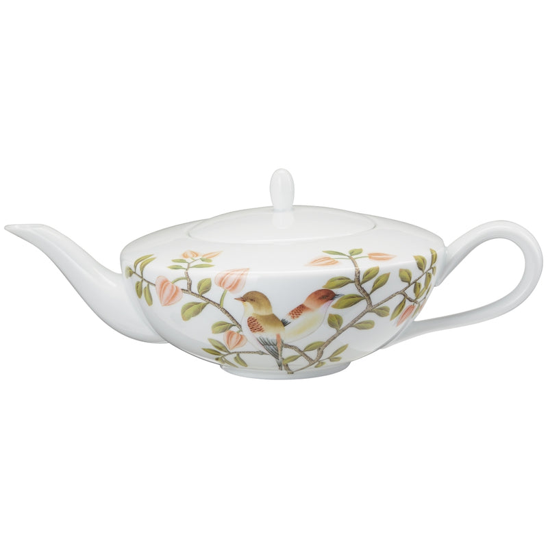 A white porcelain tea pot with green, brown, and white floral patterns and turquoise accents on the handles.