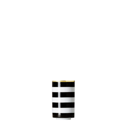 A cylindrical porcelain tea strainer beaker with black and gold stripes on a white background.