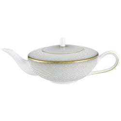 A white, gold, and black geometric patterned Raynaud porcelain tea pot with a lid.