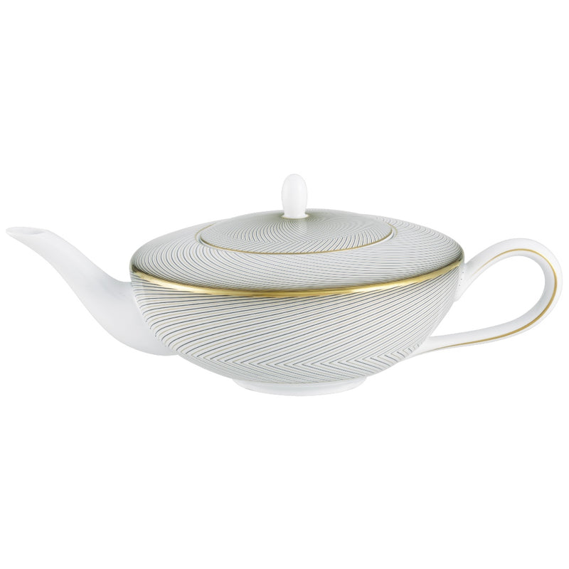A white, gold, and black geometric patterned Raynaud porcelain tea pot with a lid.