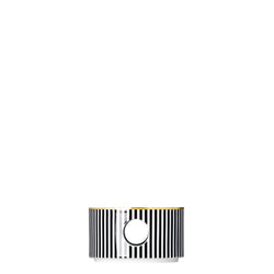 A cylindrical porcelain teapot warmer with a stripe pattern in white and black, featuring a gold or silver finish.