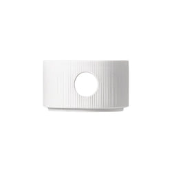 A white porcelain teapot warmer with a star-like pattern and a circular opening for tea pouring, from the STELLA series by Sieger by Fürstenberg.