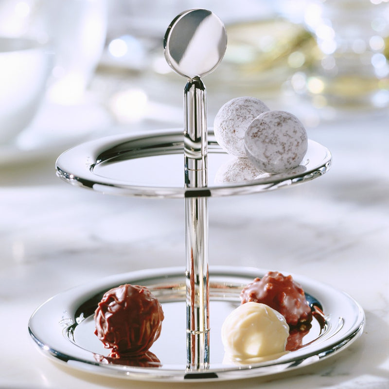 Styled Two-tier Eclipse pastry stand in silver plate by Robbe & Berking displaying assorted truffles