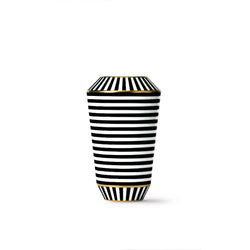 A tall, slender porcelain vase with black and white stripes and gold accents.