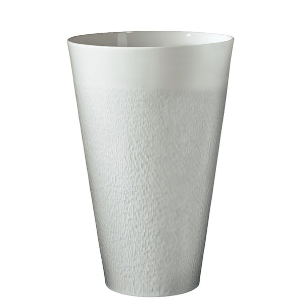 A white, round porcelain vase with a textured surface.