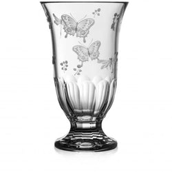 A clear, hand-cut, hand-engraved art crystal vase with a floral and animal pattern, featuring a footed design.