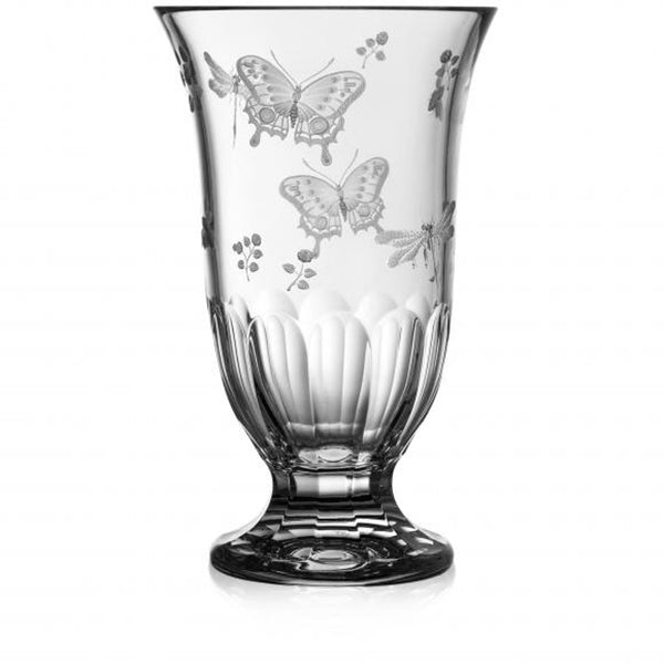 A clear, hand-cut, hand-engraved art crystal vase with a floral and animal pattern, featuring a footed design.