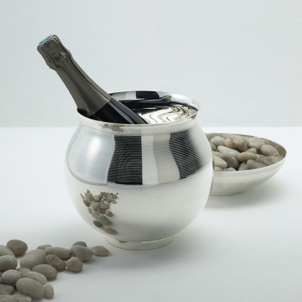 styled champagne bucket with silver bowl with stones