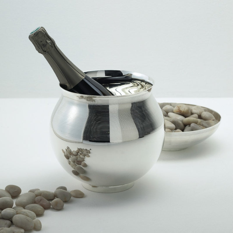 styled champagne bucket with silver bowl with stones
