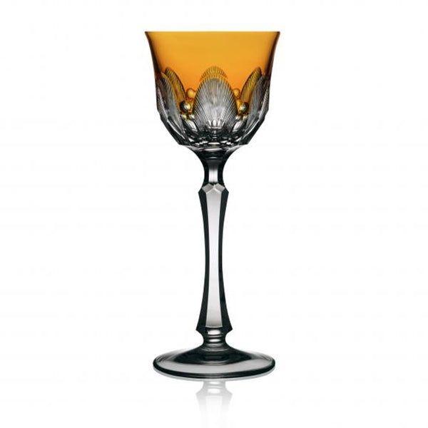 An amber-colored wine glass with a traditional cutting technique, part of the Captiva Collection.